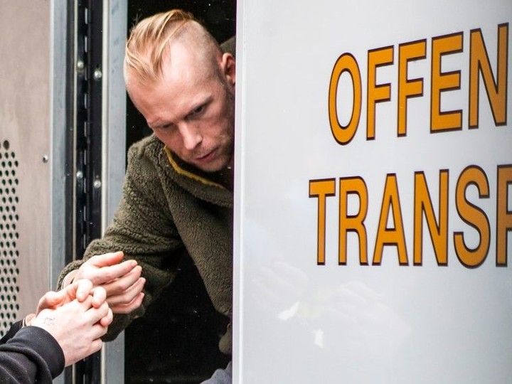  Jonathan Handel, 37, steps out of an OPP offender transport van in handcuffs at the courthouse in Peterborough, Ont., on Thursday April 4, 2024.