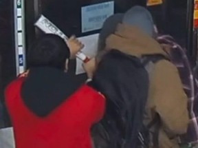 Circle K clerk Tejeshwar Kalia, 22, and an unidentified customer are seen in security video wrestling a baseball bat away from Jonathan Handel after the 37-year-old attampted a violent robbery of the store in Peterborough on Jan. 5, 2024.