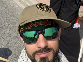 GOT MY COOL QUDS FORCE HAT: Islamic Republic devotee Mohammad Assadi wears Team Revolutionary Guard uniform. SUBMITTED