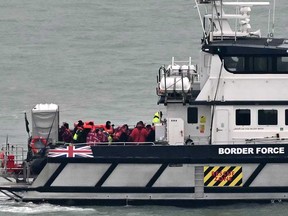 U.K. Border Force vessel Defender, carrying migrants picked up at sea attempting to cross the English Channel from France, returns to the Marina in Dover southeast England, on Jan. 17, 2024.