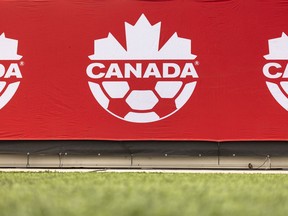 A Soccer Canada logo is displayed on the sideline at Tim Hortons Field in Hamilton, Tuesday, May 9, 2023.