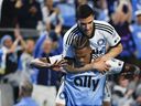 Charlotte FC forward Kerwin Vargas, front, celebrates with forward Liel Abada after scoring a goal against Toronto FC during the first half of an MLS soccer match in Charlotte, N.C., on April 13, 2024.