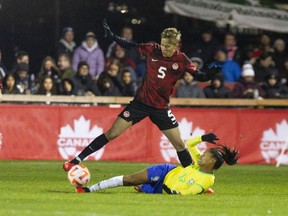 Canadian midfielder Quinn tries to get the ball around Brazil's Ary Borges during second-half soccer action in Halifax, N.S., on Tuesday, October 31, 2023. Quinn and midfielder/forward Olivia Smith have dropped out of Canada's squad for the SheBelieves Cup due to injuries sustained at their clubs.