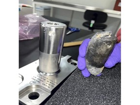 This undated photo provided by NASA shows a recovered chunk of space junk from equipment discarded at the International Space Station. The cylindrical object that tore through a home in Naples, Fla., March 8, 2024, was subsequently taken to the Kennedy Space Center in Cape Canaveral, Fla., for analysis. (NASA via AP)