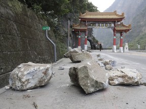 Taiwan's Central News Agency says a Canadian missing after this week's powerful earthquake on the island's east coast has been found safe, citing information from the Central Emergency Operation Center. Rocks are on the road at the entrance of Taroko National Park in Hualien County, eastern Taiwan, Thursday, April 4, 2024.