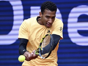 Montreal's Felix Auger-Aliassime advanced to the fourth round of the Madrid Open tennis tournament Monday in a walkover after Czech opponent Jakub Mensik retired. Auger-Aliassime plays a return to Germany's Jan-Lennard Struff during the men's singles quarterfinal match at the ATP Tour in Munich, Germany, Saturday April 20, 2024.