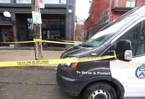 Toronto Police investigate a triple shooting that killed one man and wounded two other people on Queen St. W., near Portland St., on Thursday, April 11, 2024.