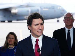 Prime Minister Justin Trudeau and National Defence Minister Bill Blair and Deputy Prime Minister and Minister of Finance Chrystia Freeland, release Canada's new defence policy during a press conference at CFB Trenton, in Trenton, Ont., Monday, April 8, 2024.