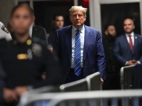 Former President Donald Trump approaches to speak to reporters as he leaves a Manhattan courtroom after the second day of his criminal trial, Tuesday, April 16, 2024 in New York.