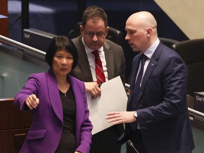  From left, Toronto Mayor Olivia Chow and Councillors James Pasternak and Brad Bradford in council chambers on Tuesday March 21, 2023.