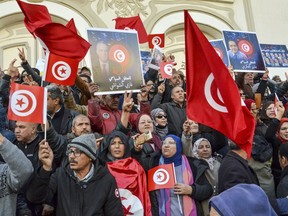 People take part in a protest against president Kais Saied