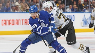 Maple Leafs' William Nylander breaks past Jake DeBrusk of the Boston Bruins during the first period at Scotiabank Arena on March 4, 2024 in Toronto.