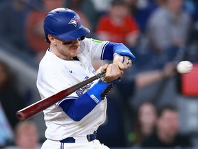 Danny Jansen of the Toronto Blue Jays strikes out in the ninth inning against the Kansas City Royals.