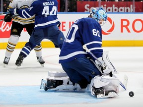 Joseph Woll of the Toronto Maple Leafs makes a save against the Boston Bruins.