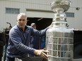 St. Louis Blues head coach Craig Berube carries the Stanley Cup in 2019.