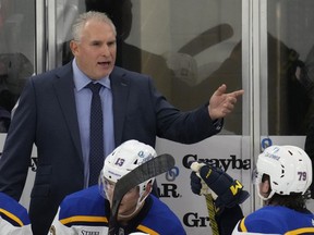 Former St. Louis Blues head coach Craig Berube talks to players during a game in 2023.