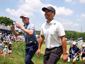 Xander Schauffele (right) and Justin Thomas walk off the ninth green during the first round of the 2024 PGA Championship.