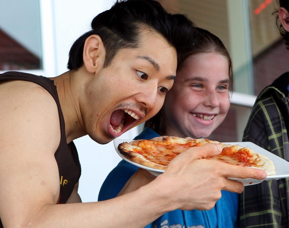 Takeru Kobayashi competes in a pizza-eating competition in Barrie in 2010.