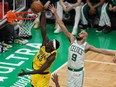 Pascal Siakam of the Indiana Pacers drives to the basket against Derrick White of the Boston Celtics.