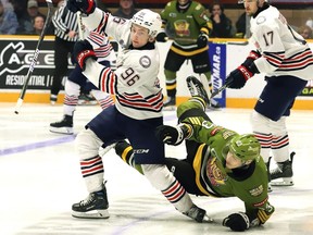 Sandis Vilmanis, of the North Bay Battalion, and Owen Griffin, of the Oshawa Generals, collide.