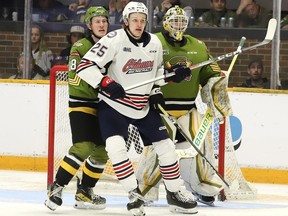 Jacob LeBlanc, of the North Bay Battalion, and Dylan Roobroeck, of the Oshawa Generals, battle for position in front of goalie Mike McIvor, of the North Bay Battalion.