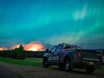 The aurora borealis shines overhead of a B.C. Conservation Officer Service vehicle.