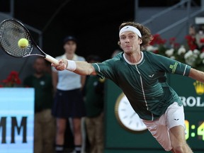 Russia's Andrey Rublev plays a return.