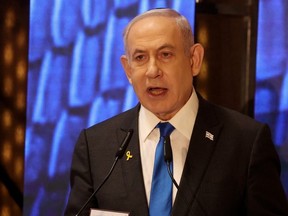 Israeli Prime Minister Benjamin Netanyahu addresses a ceremony marking Memorial Day for fallen soldiers of Israel's wars and victims of attacks at Jerusalem's Mount Herzl military cemetery on May 13, 2024.