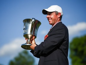 Rory McIlroy celebrates with the trophy after winning the Wells Fargo Championship.
