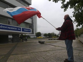 A supporter of the Slovakian government holds