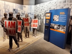 Striking sanitation workers display