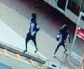 Investigators need help identifying three men and a black pickup truck sought in connection with a pharmacy robbery in Aurora on Tuesday, May 28, 2024.