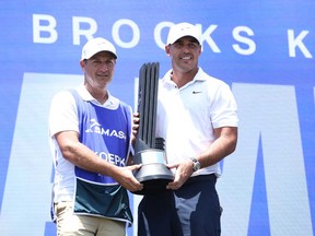 Brooks Koepka of Smash GC celebrates his win on the podium during day three of the LIV Golf Invitational - Singapore at Sentosa Golf Club on May 5, 2024 in Singapore.