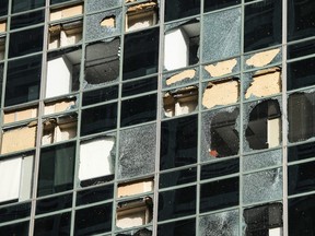 Broken windows in a downtown Houston building.