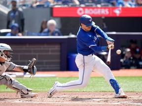 Blue Jays catcher Danny Jansen hits an RBI double during the third inning against the Chicago White Sox in Toronto, Monday, May 20, 2024.