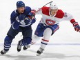 Canadiens forward Corey Perry, right, battles against Zach Hyman of the Maple Leafs in Game 2 of the first round of the 2021 Stanley Cup Playoffs at Scotiabank Arena in Toronto, May 22, 2021.