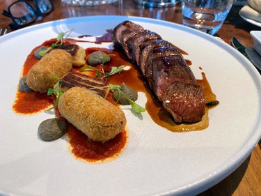 Borders grass-fed lamb loin, goat cheese gnocchi, aubergine galette, minted port sauce served at Fingal.