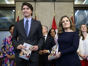 Justin Trudeau and Chrystia Freeland stand beside each other