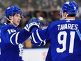 Maple Leafs forward Mitch Marner (left) celebrates his goal against the Islanders with captain John Tavares during second period NHL action in Toronto, Feb. 5, 2024.
