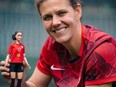 Canadian soccer star Christine Sinclair is pictured with a one-of-a-kind Barbie role model doll made in her likeness.