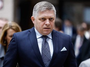 Slovakia's Prime Minister Robert Fico walks during the European Council summit at EU headquarters in Brussels on April 18, 2024.