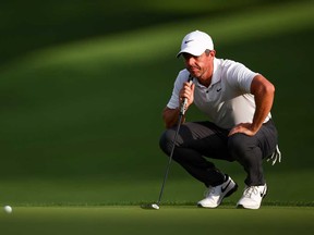 Rory McIlroy of Northern Ireland looks over a putt on the 18th hole during the first round of the Wells Fargo Championship at Quail Hollow Country Club on May 9, 2024 in Charlotte, N.C.
