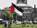 A Palestinian flag is flown as an encampment protesting Israel's war in Gaza continues to stand at the University of Toronto campus in Toronto on Tuesday, May 7, 2024.
