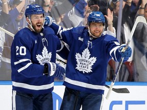 Maple Leafs defenceman Joel Edmundson (left) helps celebrate teammate William Nylander's goal against the Bruins during the third period of Game 6 of the first round of the 2024 Stanley Cup Playoffs at Scotiabank Arena in Toronto, Thursday, May 2, 2024.