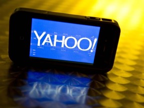 This photo illustration taken on September 12, 2013 shows the Yahoo logo on a smartphone.