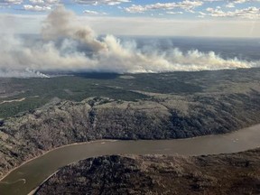 A wildfire designated MWF017 by the Alberta Wildfire Service is seen burning near Ft. McMurray, Alta., in a May 10, 2024, handout photo.