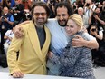 From left: Romanian-U.S. actor Sebastian Stan, Iranian-Danish director Ali Abbasi and Bulgarian actress Maria Bakalova pose during a photocall for the film "The Apprentice" at the 77th edition of the Cannes Film Festival in Cannes, southern France, on May 21, 2024.