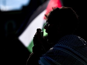 West Virginia University Muslim Student Association President Omar Ibraheem leads a chant during a pro-Palestinian protest at Woodburn Hall in Morgantown, W.Va., Saturday, May 11, 2024.