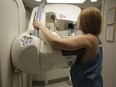 A woman gets a mammogram