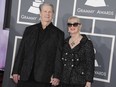 Musician Brian Wilson, left, and his wife Melinda Ledbetter Wilson arrive at the 55th annual Grammy Awards on Sunday, Feb. 10, 2013, in Los Angeles.